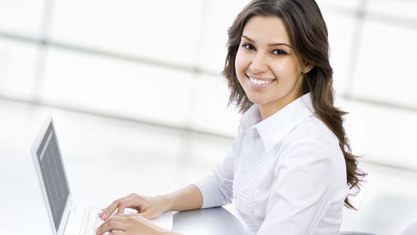 Smiling student at computer